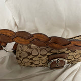 Coach with a braided handle