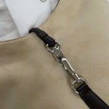 A vintage Coach shoulder bag from 2001 in beige suede with dark leather accents. The bag features a sturdy leather strap, silver-tone hardware, and a functional clasp detail on the front.&nbsp;