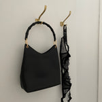 Vintage Gucci Bamboo bag with black handle and gold hardware.