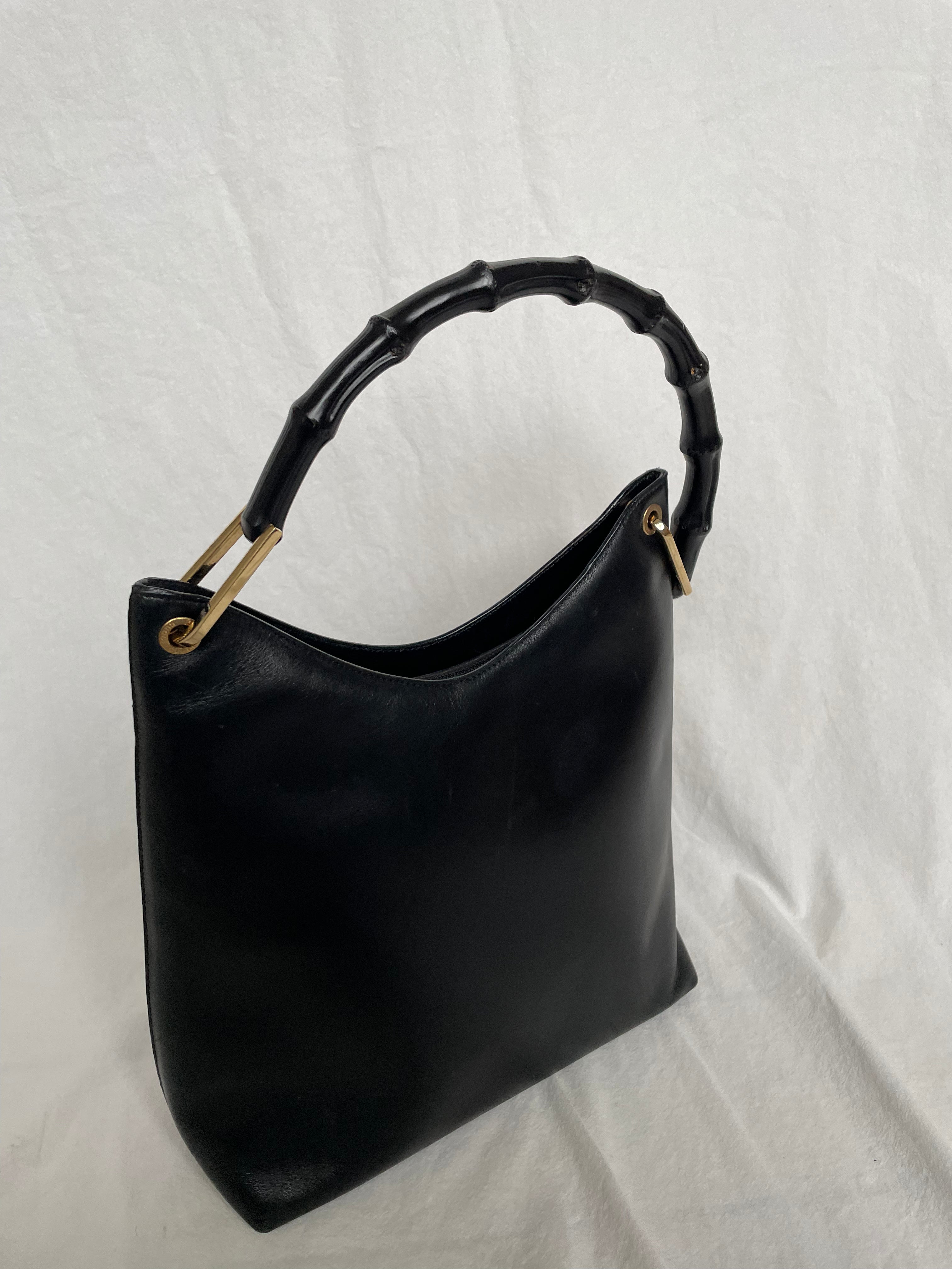 Vintage Gucci Bamboo bag with black handle and gold hardware.