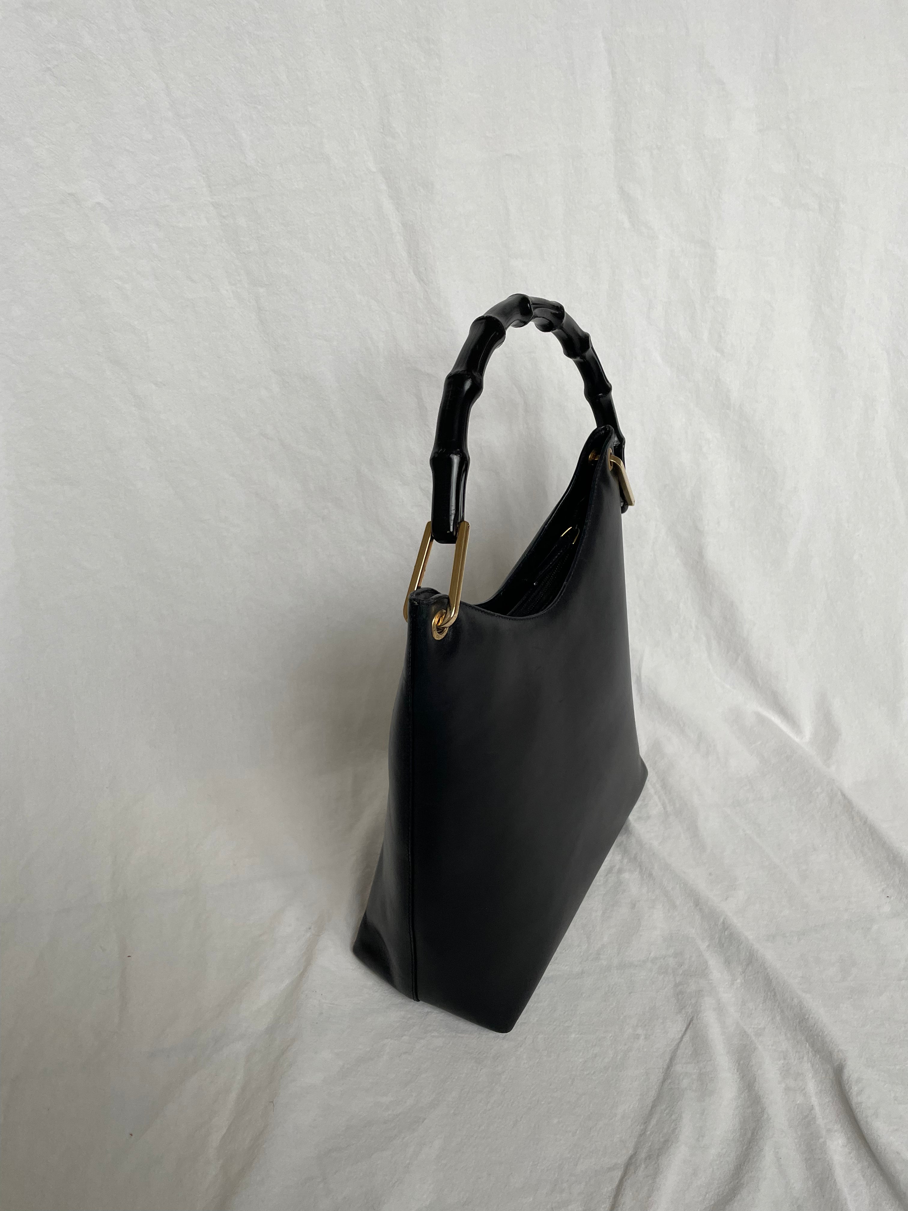 Vintage Gucci Bamboo bag with black handle and gold hardware.