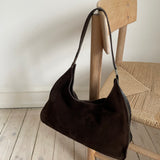 Gucci shoulder bag in dark brown suede. The leather has patina but overall the bag is in a good vintage condition.