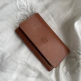 Beautiful Loewe key wallet in brown leather with white stitching. The key wallet is in a good condition and has room for 6 keys.