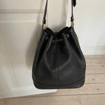 Vintage Burberrys bucket bag featuring signature canvas in the interior. The bag is overall in a good condition but the leather strap show signs of wear.&nbsp;